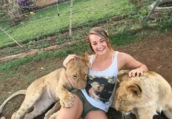 woman with lion cubs