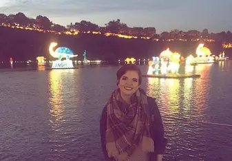 woman near water at nighttime 