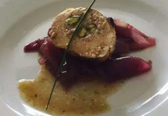 Stuffed baked chicken with pickled red onions