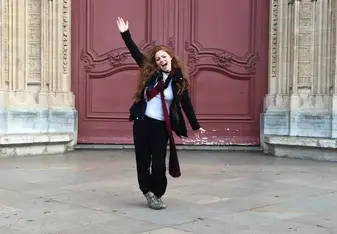 girl at building entrance