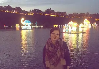 woman near water at nighttime 