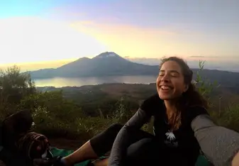female selfie at sunrise on mountain