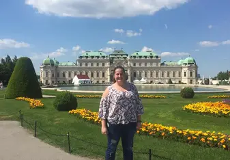 woman standing in front of castle