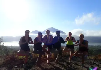 Males students doing yoga and posing in Bali