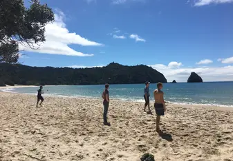 Playing some volleyball at New Chums Beach
