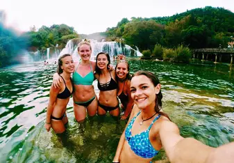 group photo at waterfall.