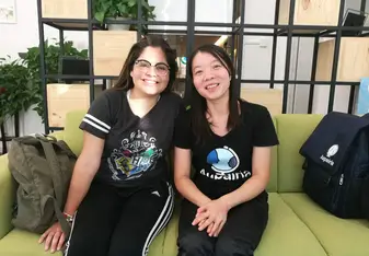 Two females smiling