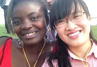 2 females smiling