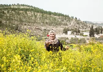 woman in field of flowers
