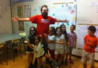 teacher with face paint and students