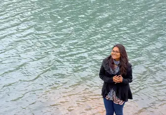 woman smiling by the ocean
