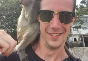 Selfie of man and monkey