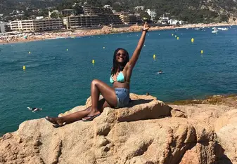 girl on cliffs above ocean