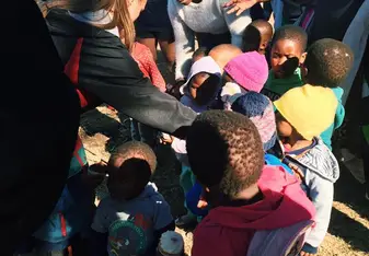 Playing with kids at our service site.