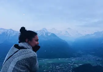 girl overlooking snowy mountains 