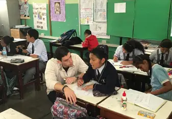 teacher and student at desk