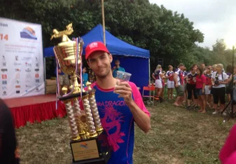 man holding trophy