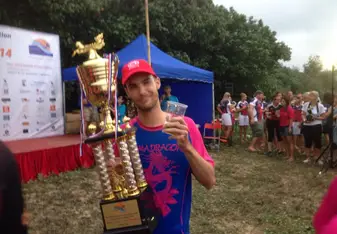 man holding trophy