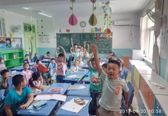 students smiling in classroom in china