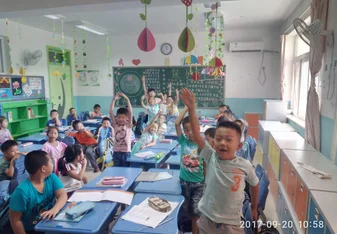 students smiling in classroom in china
