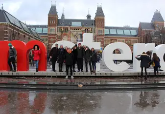 Group photo at Amsterdam sign