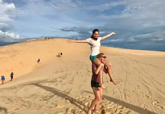 my good friend on my shoulder at the sand dunes in Vietnam. 