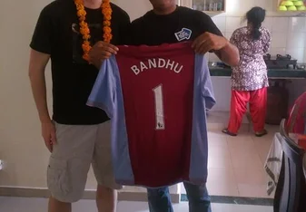 two men holding jersey