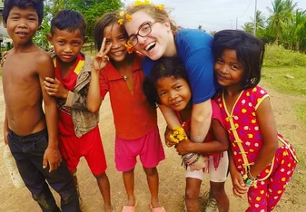 woman with group of small children