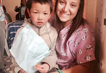 dentist holding young patient