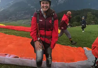 girl on ground with parachute