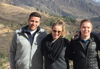 photo of three adults in nature
