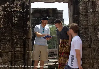 teacher with students at historical site