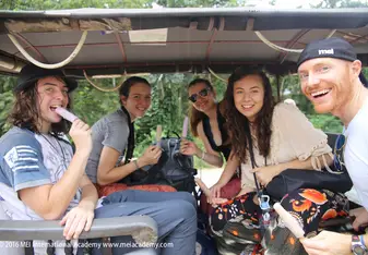 group photo of students in car