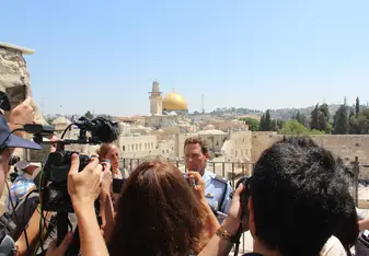 Israeli Police Foreign Spokesman Micky Rosenfeld talking to a pool of reporters. 