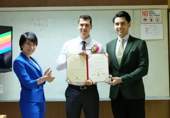 man receiving diploma