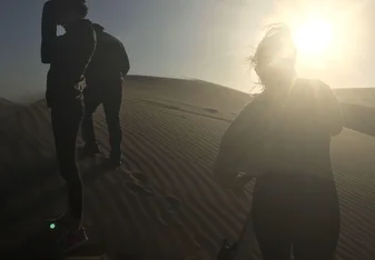 Sand boarding at the dunes of Huacachina