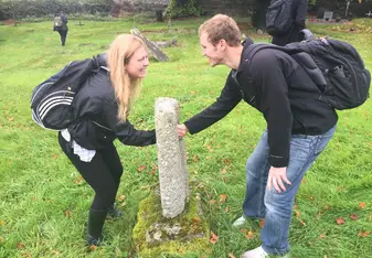 girl and guy smiling in Ireland outside