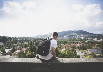 Guy with backpack pixabay featured Thumbnail