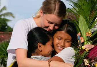 Nora with two student at the Goodbye ceremony