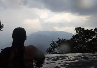 Female relaxing by the pool