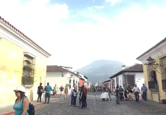 A picture of showing the volcanoes surrounding the historical city of Antigua, Guatemala.