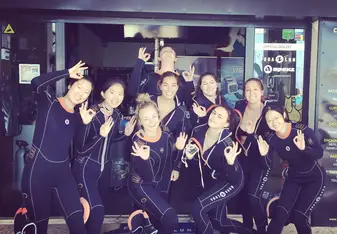 Group of girls in diving suits.