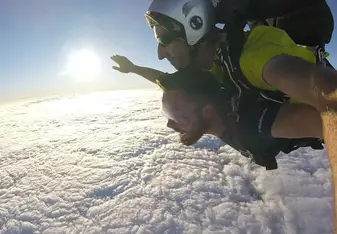 Guy skydiving.