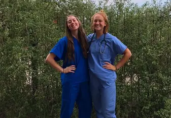 Two girls in nurse's suits.