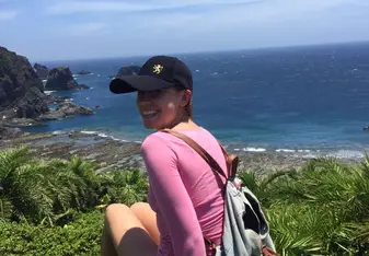 Girl by the coast.