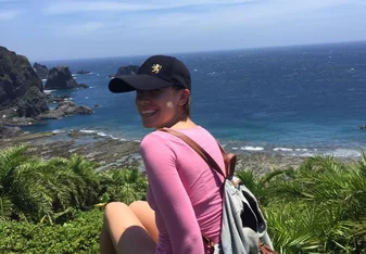 Girl by the coast.