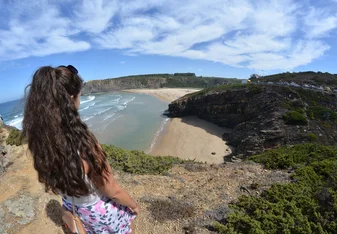 Girl facing the cliff.