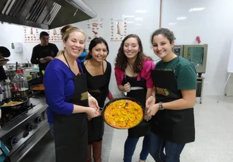 IES Abroad Salamanca students cooking a traditional Spanish dish 