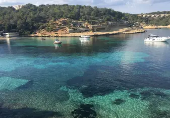 This is one of the hidden gems within Mallorca, a beach next to ancient caves that can be explored. 