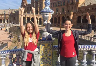 Holding up the IU fists and blades pose in front of the plaza de Espana.